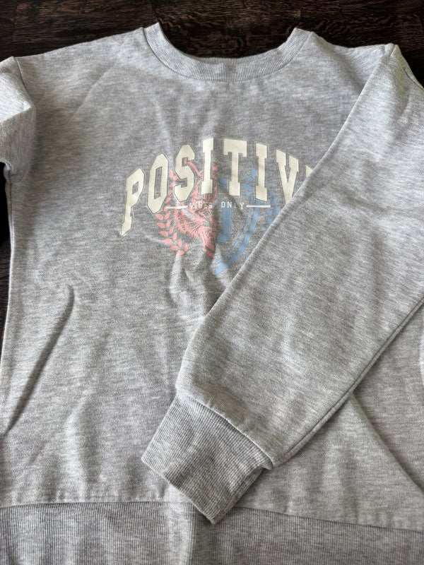 Primark positive peysa