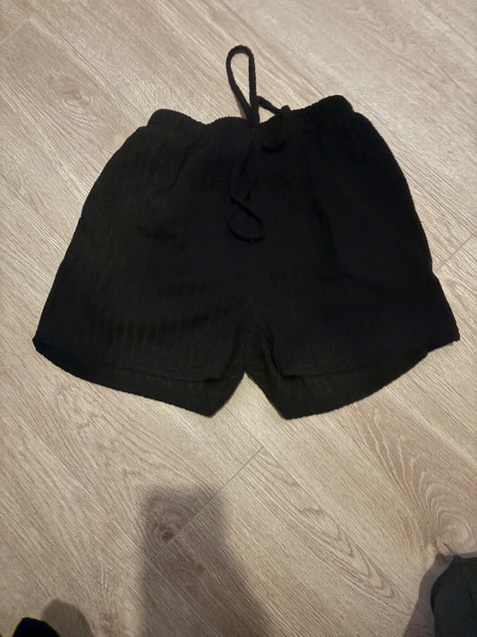 Stuttar reimdar buxur