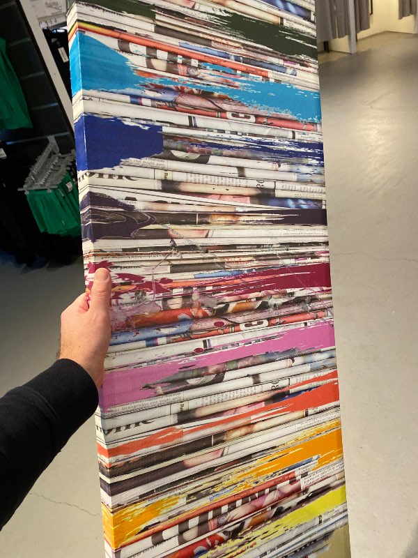 Painting of newspaper and rainbow colours