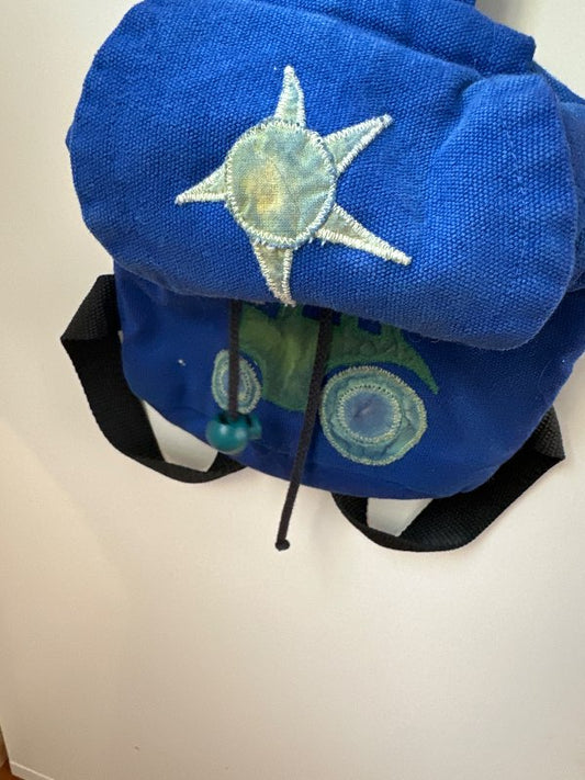 Tiny blue backpack